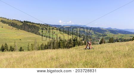 Motorcyclist on Carpathian Mountainss extreme sport active lifestyle adventure touring concept