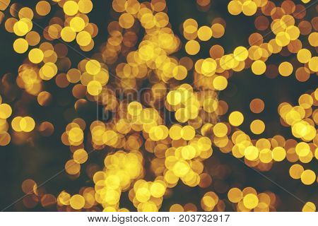 Defocused lights abstract golden nonagon bokeh background