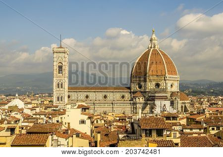 cathedral of florence and its dome of one hundred fourteen meters of height and background the mountains of tuscany