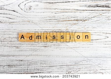 ADMISSION word made with wooden blocks concept