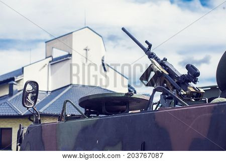 m2 browning machine gun on M113 armored personnel carrier Near a church