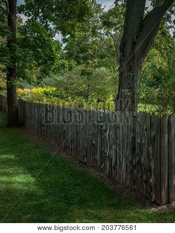 Dundurn Park Hamilton Ontario Canada. September 8 2017. Log fence and green grass. 2017