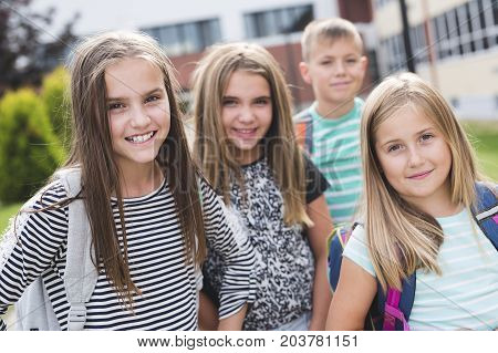 The Great Portrait Of School Pupils Outside Classroom Carrying Bags