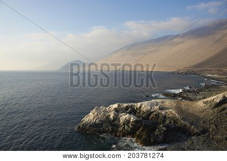 White guano covered cliffs along the Pacific coast of northern Chile.