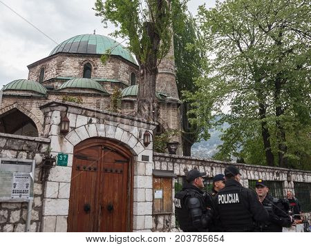 SARAJEVO BOSNIA AND HERZEGOVINA - APRIL 15 2017: Bosnian police units wearing bulletproof jackets patrolling in front of one of the mosques of the city center of Sarajevo capital city of Bosnia
