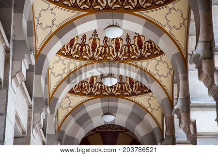 SARAJEVO BOSNIA AND HERZEGOVINA - APRIL 16 2017: Exterial columns of the main hall of the Vijecnica the former library and city hall of Sarajevo destroyed during the 1991-1995 conflict and reconstruted characterized by its ottoman style