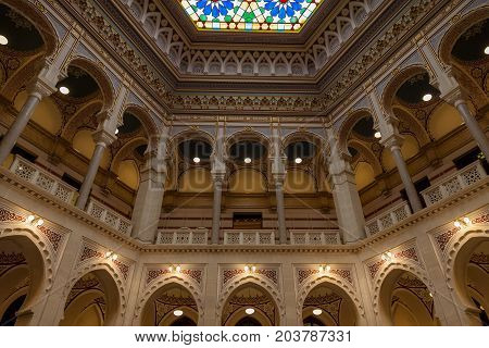SARAJEVO BOSNIA AND HERZEGOVINA - APRIL 16 2017: Interior of the main hall of the Vijecnica the former library and city hall of Sarajevo destroyed during the 1991-1995 conflict and reconstruted characterized by its ottoman style