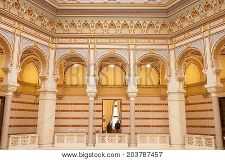 SARAJEVO BOSNIA AND HERZEGOVINA - APRIL 16 2017: Interior of the main hall of the Vijecnica the former library and city hall of Sarajevo destroyed during the 1991-1995 conflict and reconstruted characterized by its ottoman style
