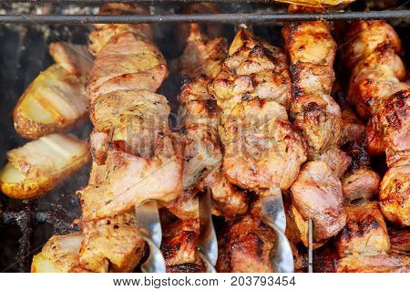 The Smoke Rises Over The Fried Meat On The Skewers On The Coals.