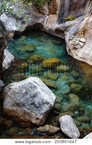 Vertical shot of crystal clear water in mountain river in Sapadere canyon near Alanya of Turkey