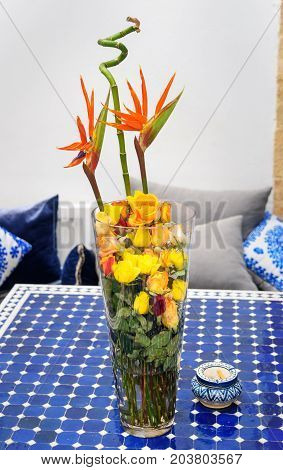 Flower arrangement on the blue table. Morocco