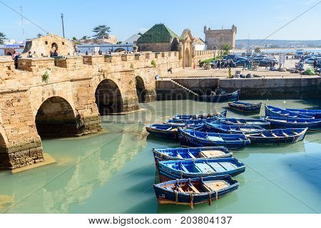 Fortress And Blue Fishing Boats In Essaouira. Morocco