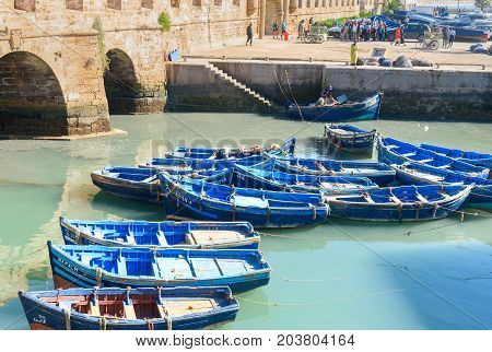 Fortress And Blue Fishing Boats In Essaouira. Morocco