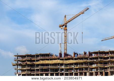Crains on construction site of building. Construction background