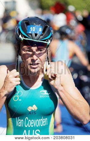 STOCKHOLM - AUG 26 2017: Triathlete Natalie Van Coevorden (AUS) fixing the helmet in the transition zone in the Women's ITU World Triathlon series event August 26 2017 in Stockholm Sweden