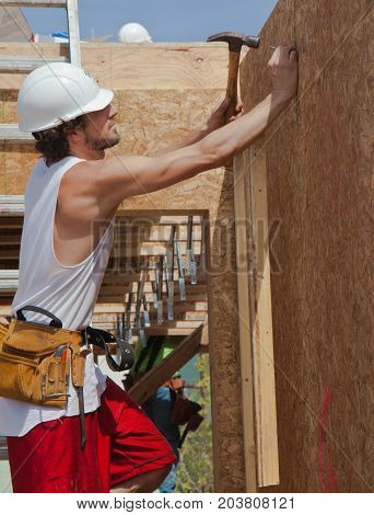 Man Builds Wall For Home For Habitat For Humanity