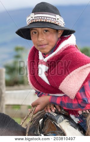 June 3 2017 Machachi Ecuador: closeup of a young boy dressed as cowboy from the Andes region called 'chagra' in traditional wear