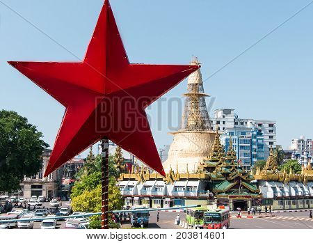 YANGON, MYANMAR - JANUARY,20,2016: Buddhist monks bhikkhunis in festive attire in Shwedagon Pagoda.during the celebration of the Buddhist holiday.in Yangon, Myanmar.