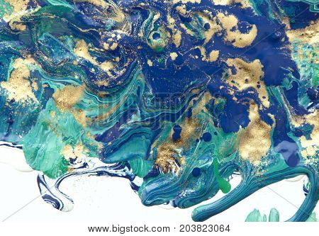 Marbled abstract background. Liquid marble pattern. Colorful marble backdrop. Golden glitter texture