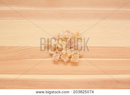 Cubes Of Crystallised Stem Ginger On Wood