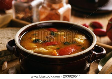Hungarian soup goulash (bograch) with dumplings .