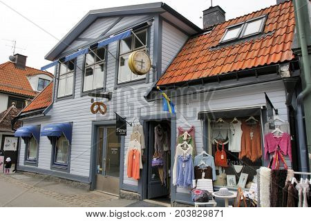 SIGTUNA, SWEDEN - JULY 29: Sigtuna is the oldest city in Sweden and is located about 50 Km northwest of Stockholm in Provinz Uppland. Shoping in historical buildings in Sigtuna Sweden on July 29 2012