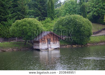 House for ducks on the lake in a rainy day