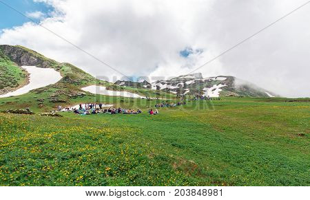 A lot of tourists have a rest at ascension on mountain top.
