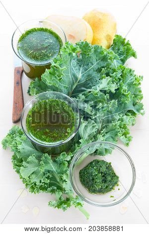 Very healthy smoothie with green kale leaves and pear.