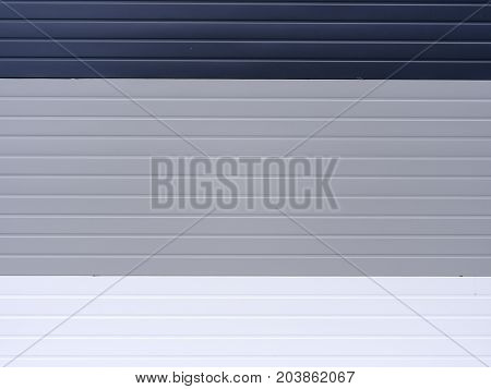 Different colors of the surface. Varicoloured and stylish high fence. Abstract picture. Ourside World. Vinyl products. Protection of the house.