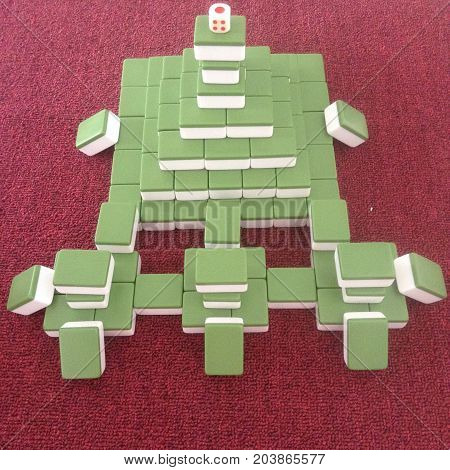 Red mahjong mat, green mahjong styling close-up .