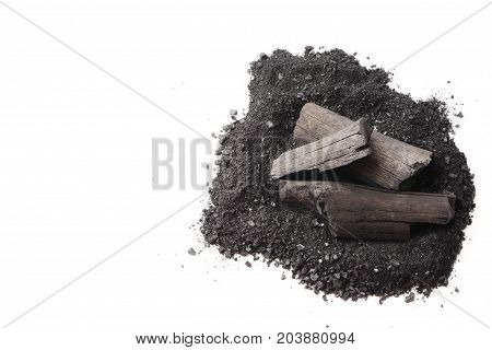 Charcoal and powder (activated carbon) on white background. Free space for text