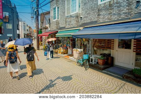 TOKYO, JAPAN JUNE 28 - 2017: Unidentified people walking at Komachi-dori Street, in Kamakura in Tokyo Japan, a stylish street in the ancient city of Kamakura With historic restaurants and fashionable stores.