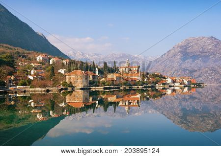 View of seaside Prcanj town on a sunny winter day. Bay of Kotor (Adriatic Sea), Montenegro