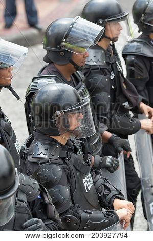 June 24 2017 Cotacachi Ecuador: riot police with shields standing on the side of the street during the Inti Raymi parade