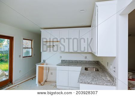 Custom Kitchen Cabinets In Various Stages Of Installation Base For Island In Center