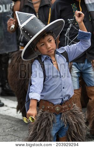 June 24 2017 Cotacachi Ecuador: closeup of an indigenous quechua young boy participating at the Inti Raymi parade