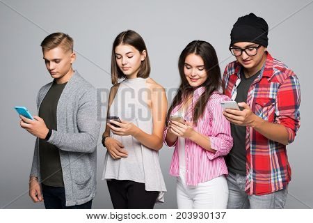 Indoor Shot Of Four People F Working Together In One Company, Doing Team Work, Using Modern Gadgets