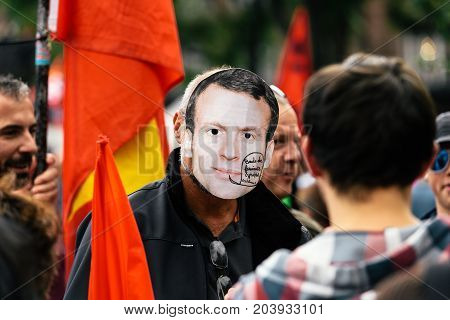 Man Wearing Emmanuel Macron Mask At Protest