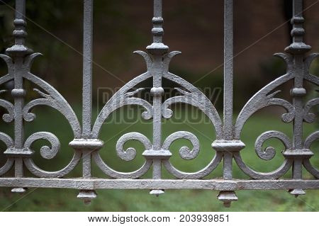 Vintage wrought iron fence around a park in France