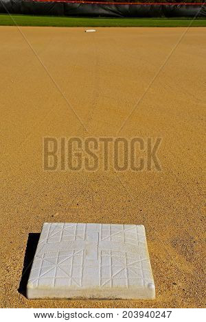 Second base is seen 90 feet down the line from third base on a baseball diamond