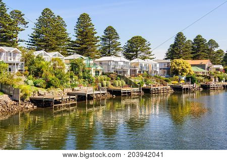 Piers and holiday houses along the Moyne River - Port Fairy, Victoria, Australia