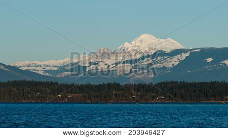 Winter view of Mount Baker with Padilla Bay in the foreground.