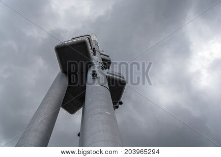 Prague, Czech Republic - August 21, 2017: Zizkov Television Tower in Prague. It is is a  transmitter tower and an example of high tech architecture. Low angle view a cloudy day of summer.