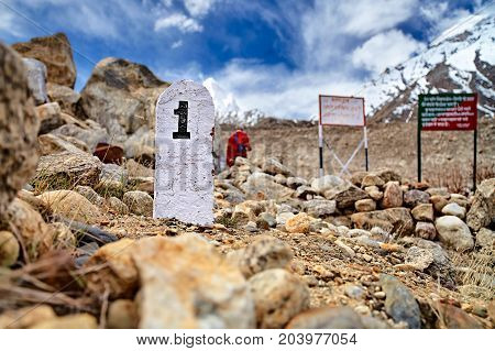 1st Kilometer stone in Himalaya mountains. Gangotri glacier Gaumukh India.