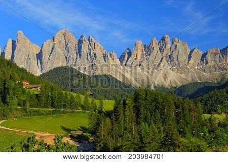 Santa Magdalena village in front of Dolomites Group, Val di Funes, Italy,
