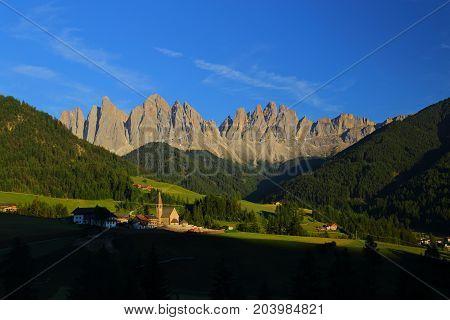 Santa Magdalena village in front of Dolomites Group, Val di Funes, Italy,