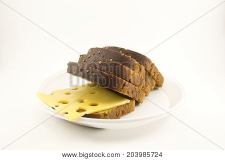 beautifully sliced black bread with cheese on isolated background