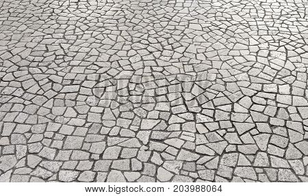 Texture of the old paving stones. Close-up.