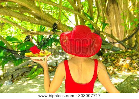 Healthy Exotic Summer Diet. Back Side Of Tourist Woman In Red Dress Holding Fresh Fruit Plate At Ans